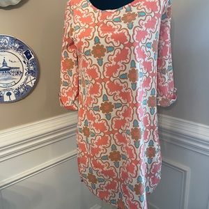 Cream and peach dress.